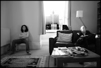 two people sitting in a living room